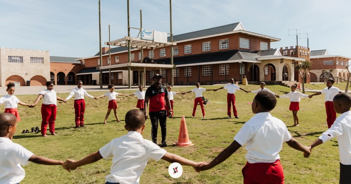 Children playing soccer during a community sports session
